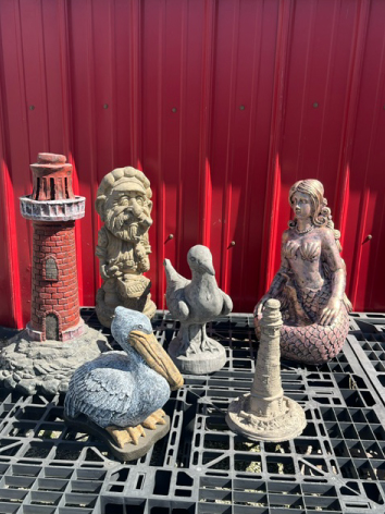 Examples of nautical themed cement garden statues