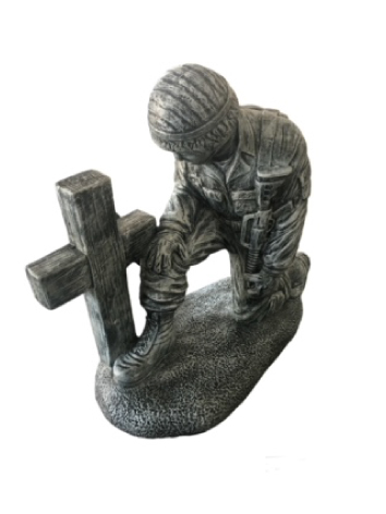 Soldier kneeling at the cross cement yard statue