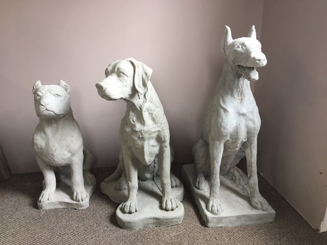Examples of types of cement dog garden statues